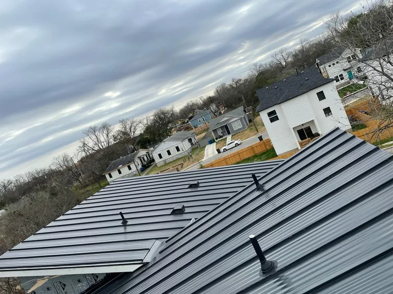Standing seam metal roof panels with vents for Skylight Repair in Elk Ridge